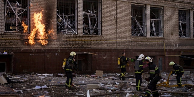 Firefighters work to extinguish more fires following a Russian attack in Kharkiv, Ukraine on Saturday, April 16, 2022.